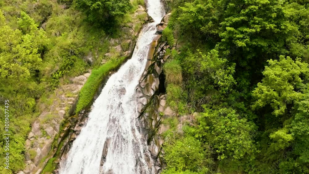Aerial view of beautiful Efrata waterfall in the mountains in slow motion. Samosir, Indonesia. Aerial view of beautiful Efrata waterfall in the mountains in slow motion. Samosir, Indonesia.