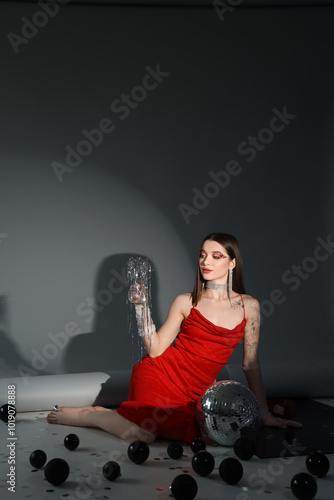 Young woman with disco ball...