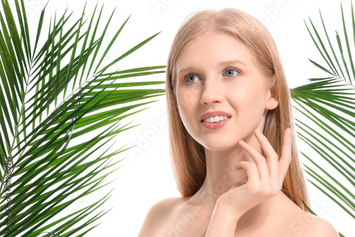 Young blonde woman and palm...