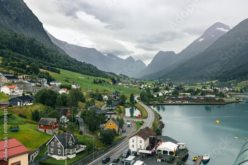 Εκτύπωση καμβά Alusund, Norway 15 Aug 2024 - A scenic fjord surrounded by towering mountains, with a charming village along its shore