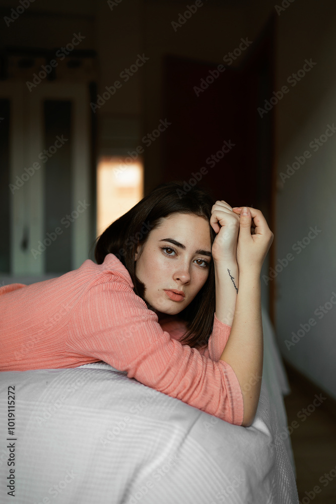 Woman lying on bed in daylight Woman lying on bed in daylight
