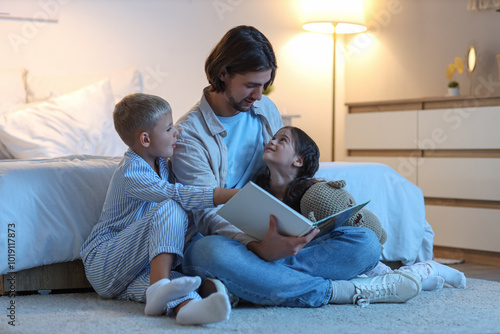 Father reading bedtime stor...