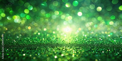 Abstract background of defocused green ray lights with bokeh and glitter