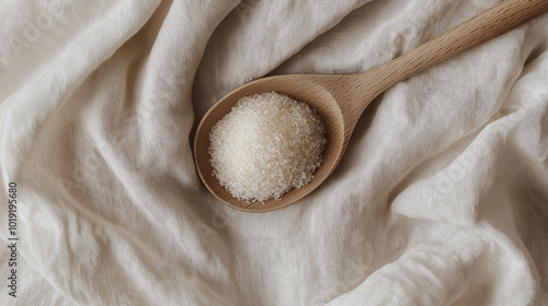 allulose, d-allulose, d-psicose, rare sugar concept image: top down view, a small pile of sugar in a wooden spoon placed in the center of a soft
