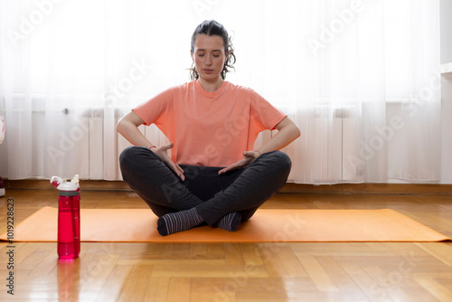 Sport exercise at home set. Beautiful young woman doing workout indoor. Yoga and fitness, healthy lifestyle.