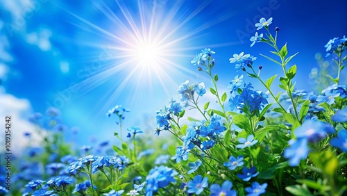 A field of vibrant blue wildflowers basking in the warm glow of a radiant sun, showcasing nature's delicate beauty against a backdrop of a clear azure sky.