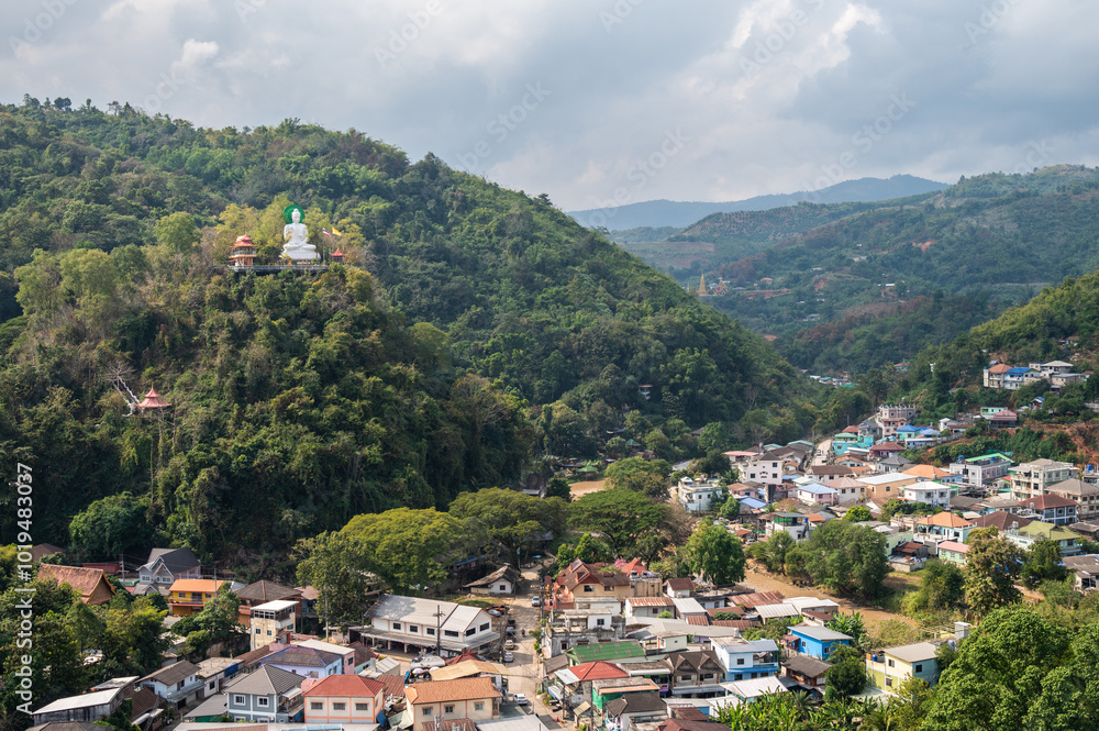 Fototapeta premium A white Buddha located at the border of Thailand and Tachileik the border town in Shan state of Myanmar.