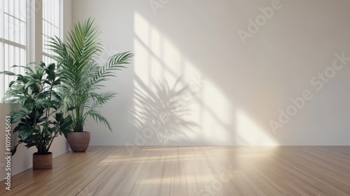 Empty white room with a wooden floor and plants.