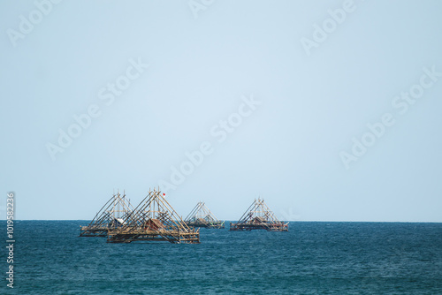 A Floating Bagan in the Midst of Blue Waters. Breathtaking Summer Beach with Crystal Blue Waters. Traditional fish aggregating device, bamboo fish trap.