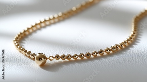 Gold necklace isolated on a clean white background sleek and minimalist design