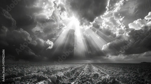Some big and low clouds over a lake, with coming out below them