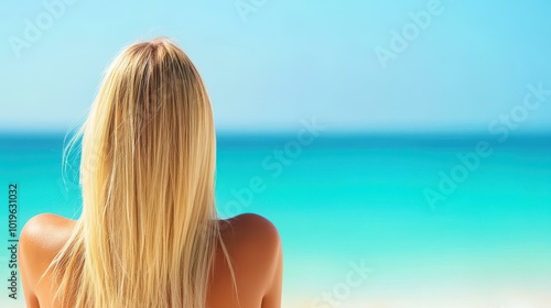 A sunkissed blonde woman unwinds on a serene tropical beach, with soft waves and palm trees in a blurred backdrop.