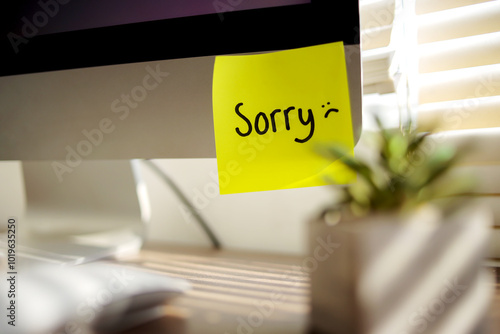 SORRY! word Handritten Sticky Note on computer  photo