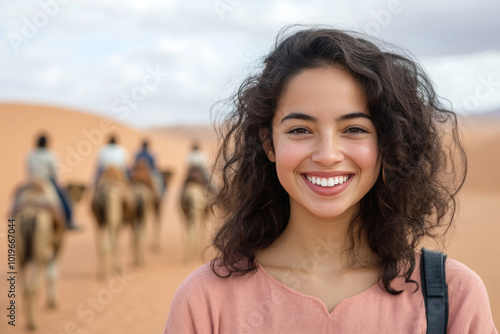 Hispanic woman wearing traditional cloth moroccan Djellaba at the desert