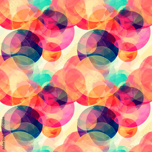 Vibrant abstract pattern with overlapping circles in vibrant shades of red, orange, yellow and turquoise. Seamless background