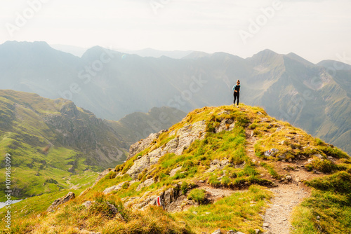 Tableau sur toile Hiking in Fagaras mountains on Iezerul Caprei peak over Transfagarasan serpentine road carpathian mountains