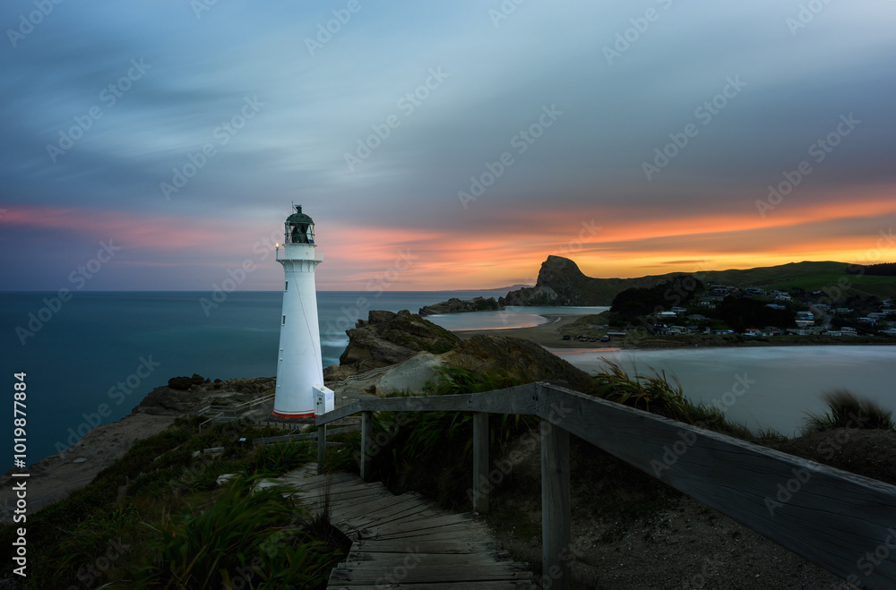 Castlepoint lighthouse and Castle Rock at sunset. Wairarapa. New Zealand.