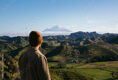 Traveler man observing the landscape of Mount Taranaki