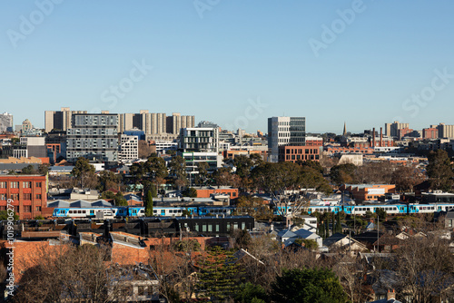 Melbourne Australia skyline with train passing through the city photo