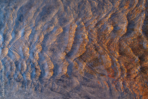 Tide pool and ripples on water, close up photo