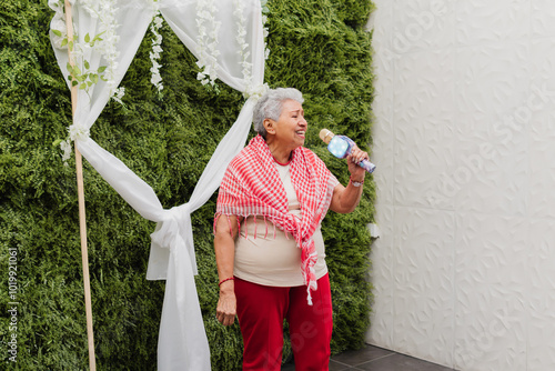 Adorable grandmother singing. photo