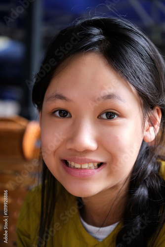 Closeup of an Asian girl drinking Chinese tea in an outdoor teahouse photo