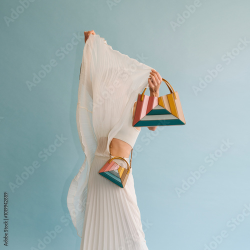 Elegant Woman Modeling Colorful Geometric Handbags photo