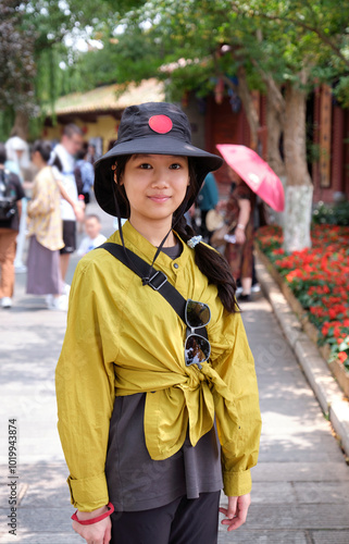 Chinese girl in the old park in Kunming, China photo