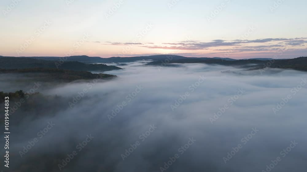 aerial sunset above the clouds , drone fly in unpolluted nature with mountains peaks above the fog in misty scenic countryside aerial sunset above the clouds , drone fly in unpolluted nature with mountains peaks above the fog in misty scenic countryside