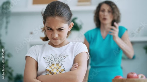 Video of angry mother and daugther arguing in the kitchen at home