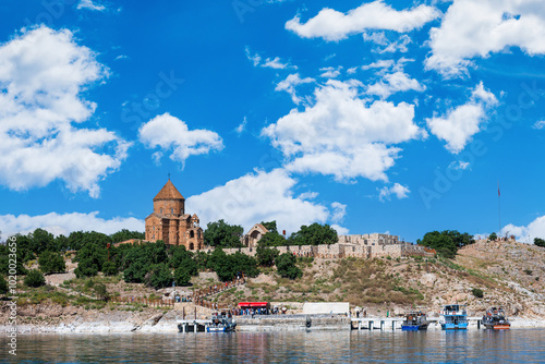 Akdamar Island in Van Lake with The Armenian Cathedral Church of the Holy Cross, a famous historic site in Van, Turkey photo