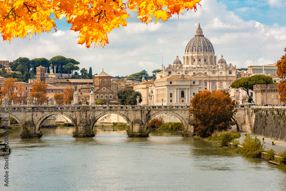 Fototapeta premium St Peter's basilica in Vatican and St. Angel bridge over Tiber river in autumn, Rome, Italy