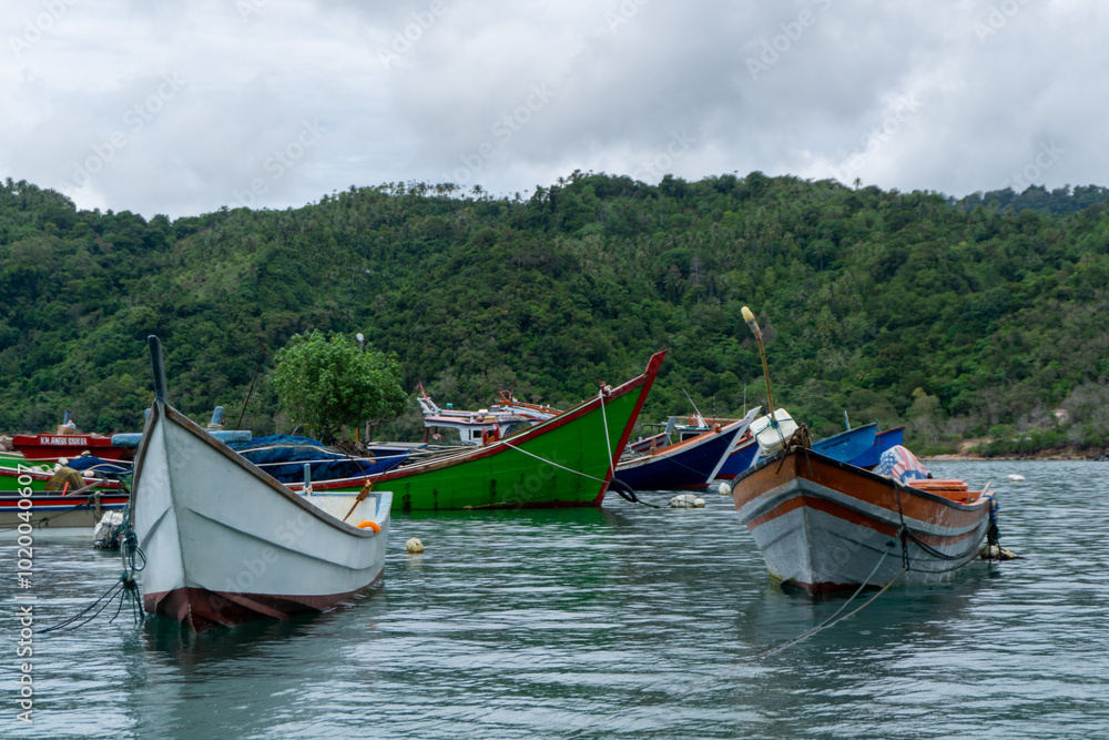 Fishing and tourist boat at the dock. Fisherman boat at the harbour in Sabang Island in Sumatera Indonesia. Fishing and tourist boat at the dock. Fisherman boat at the harbour in Sabang Island in Sumatera Indonesia.