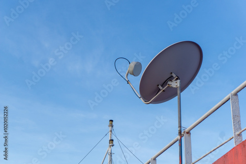 TV satellite antenna on the ship deck. Satellite tv receiver.