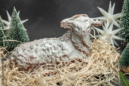 Christmas lamb cake with traditional New Year decor. Baked sweet dessert with sugar icing photo