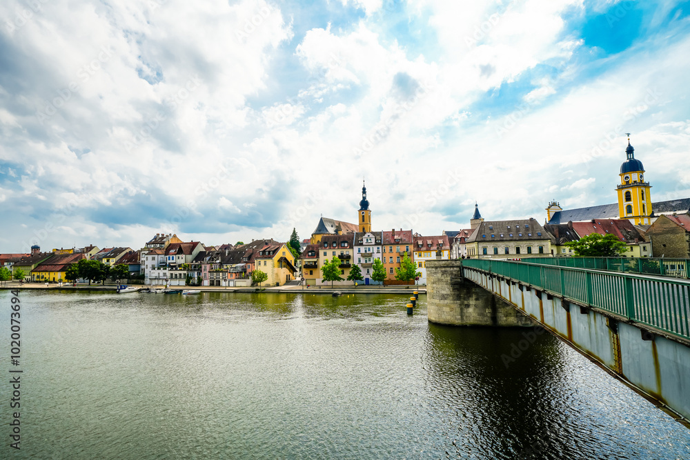View of the Main and the Old Main Bridge in Kitzingen. Medieval stone bridge of the city. View of the Main and the Old Main Bridge in Kitzingen. Medieval stone bridge of the city.