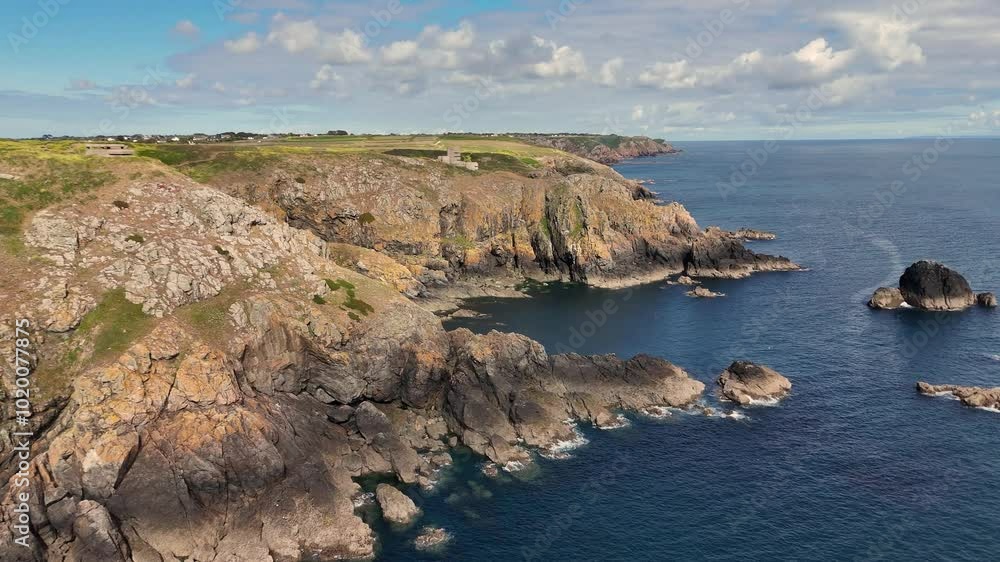Guernsey. High flight over the cliffs and fortifications on the south coast of the Island on bright sunny day Guernsey. High flight over the cliffs and fortifications on the south coast of the Island on bright sunny day