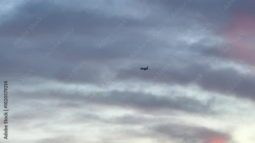 Airplane fly in the sky, beautiful colour evening before sunset Airplane fly in the sky, beautiful colour evening before sunset