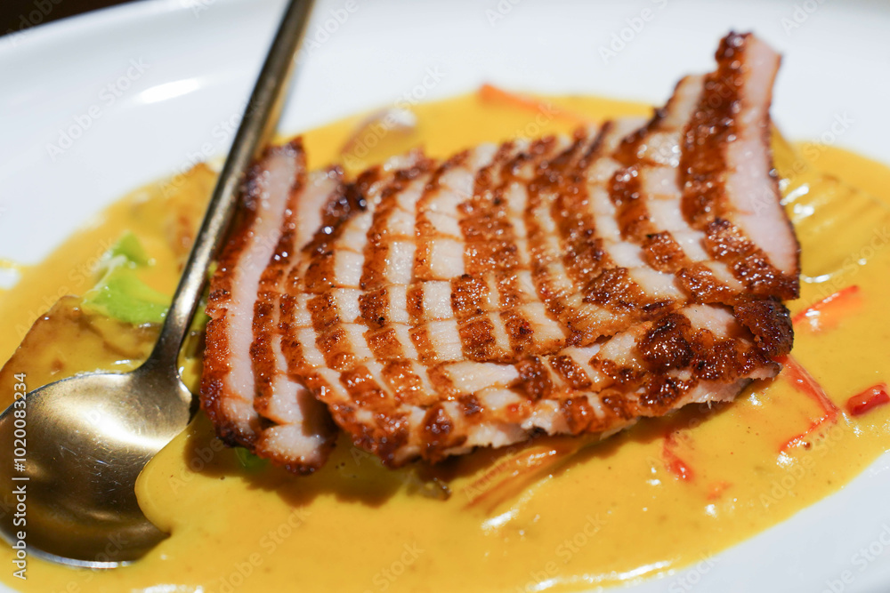 Thai food, sliced pork with curry, close up.