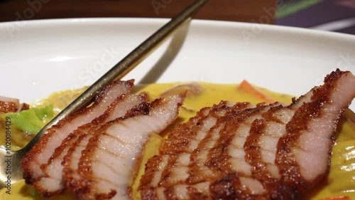 Thai food, sliced pork with curry, close up. photo