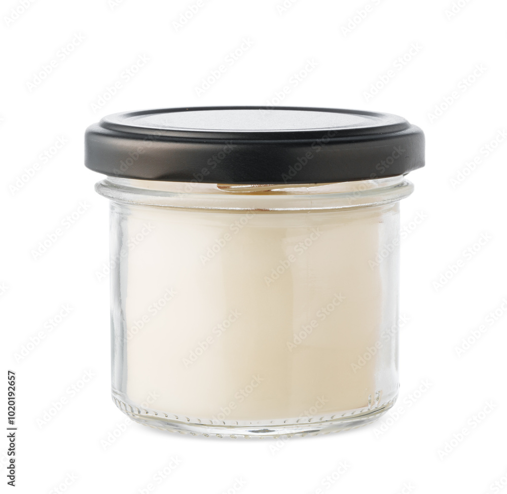 A beautifully crafted scented candle in a clear jar with a wooden wick A beautifully crafted scented candle in a clear jar with a wooden wick