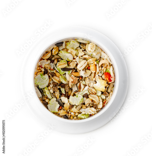 Nutritious seed mix served in a bowl with additional snacks for pet at home