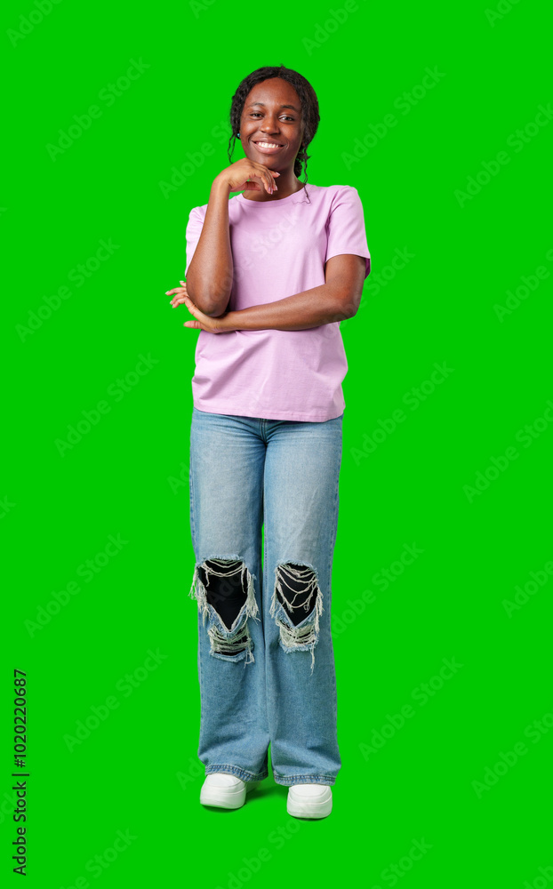 Young woman smiling joyfully in a pink shirt against a vibrant green background in a cheerful atmosphere Young woman smiling joyfully in a pink shirt against a vibrant green background in a cheerful atmosphere