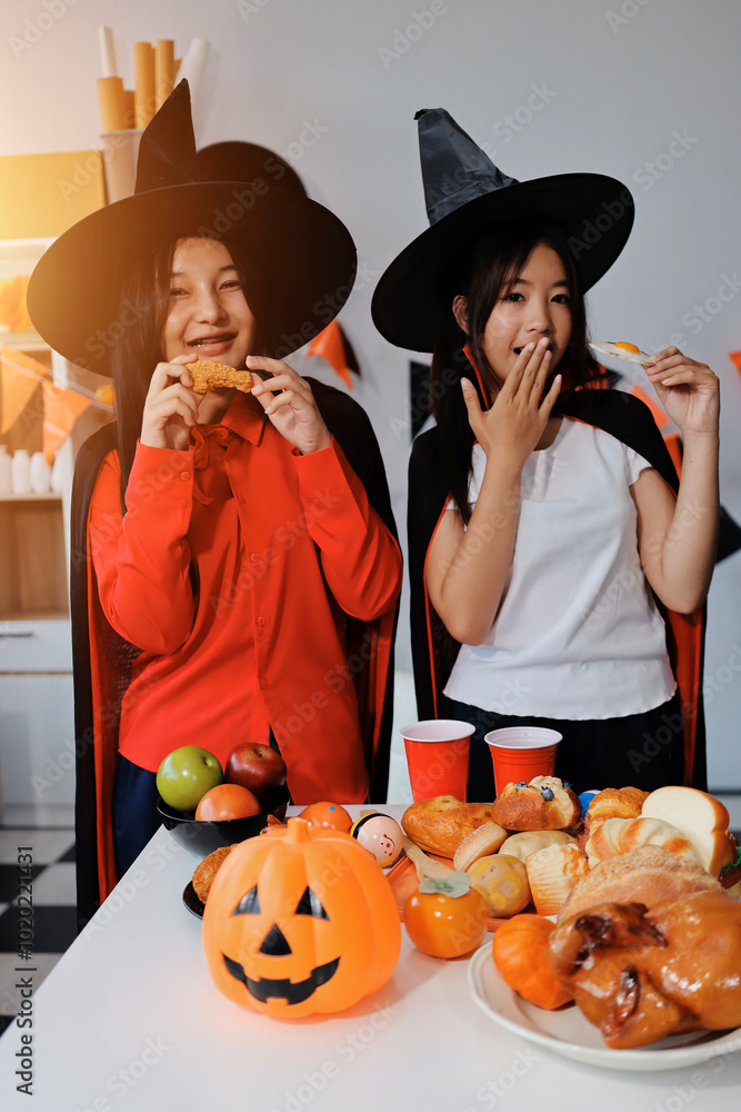 Fototapeta premium friendship, holiday and people concept - group of happy smiling friends in halloween costumes of vampire, devil, witch and cheetah at home party