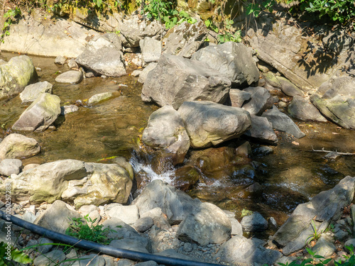 Large boulders in a stream. Mountain river. Nature.