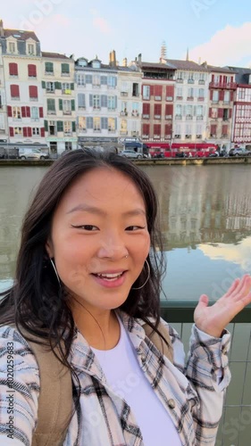 Real camera point of view of woman talking to camera. Asian woman live streaming on social media.