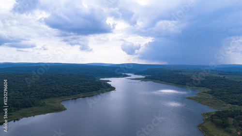 Drone shot. Aerial view scenic landscape of a large river delta amid a lush forest at the tropical Asia place