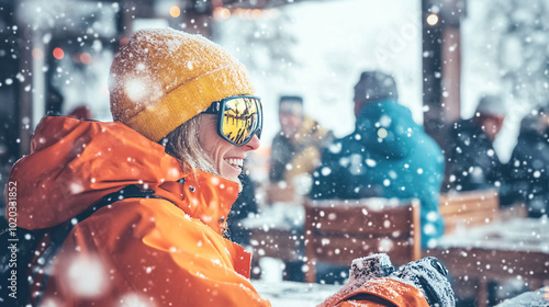 A snowboarder having fun at a ski resort bar with friends in winter. Crowded winter destination, skiing in the Alps, snowboarding season.