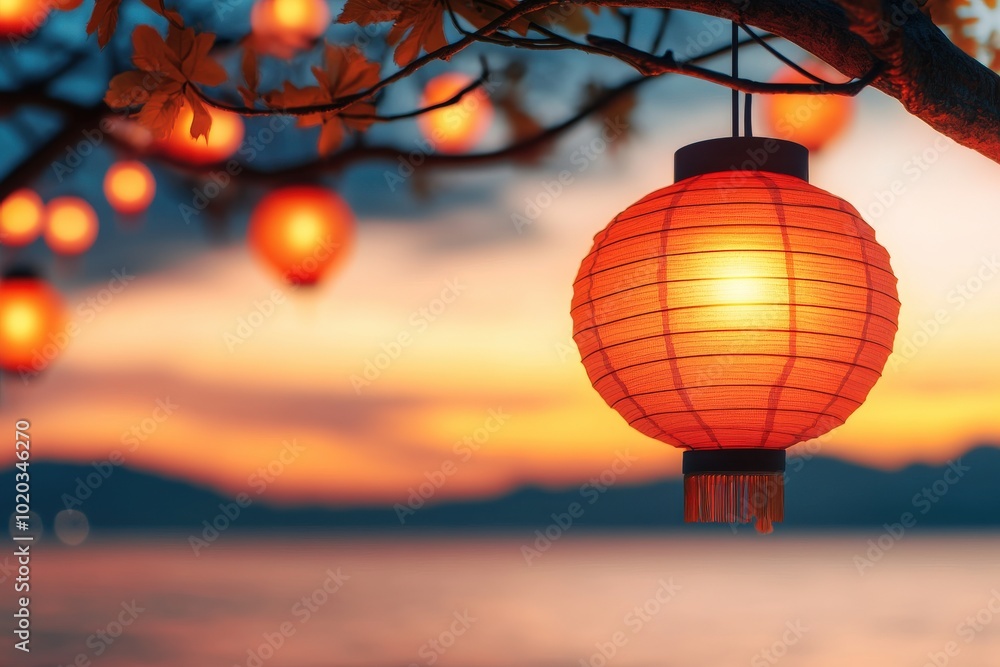 Obraz premium vibrant red Chinese lantern illuminates serene landscape during Mid Autumn Festival, casting warm glow against tranquil backdrop of mountains and water