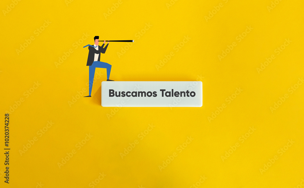 Buscamos Talento. Spanish Text on Block Letter Tile on Yellow Background. Minimal Aesthetic. Buscamos Talento. Spanish Text on Block Letter Tile on Yellow Background. Minimal Aesthetic.
